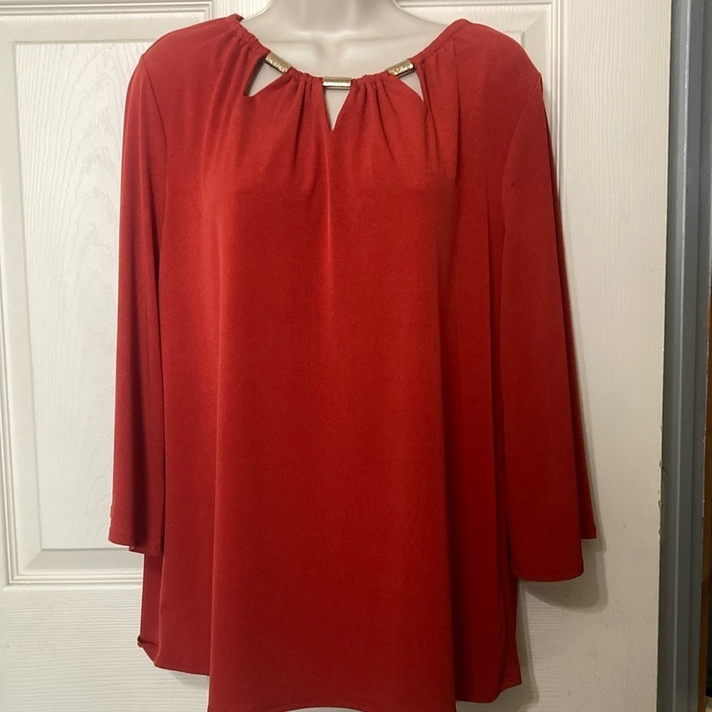 Rust color top with cut out collar size M